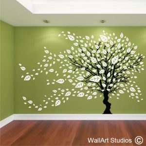 Tree in the Wind with Blowing Leaves